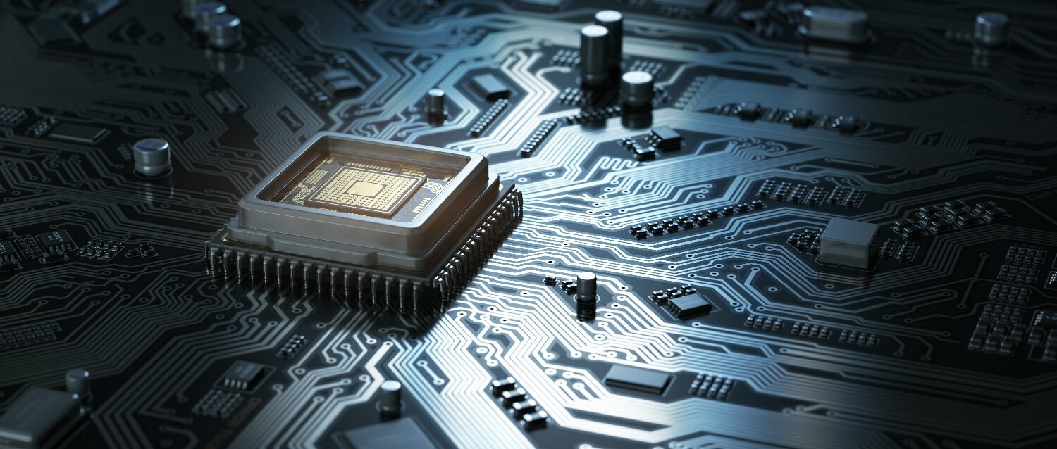 Close-up of a microchip on a circuit board with electronic components.